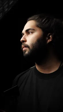 Jardel Montenegro, in profile, lit by a single hard key light